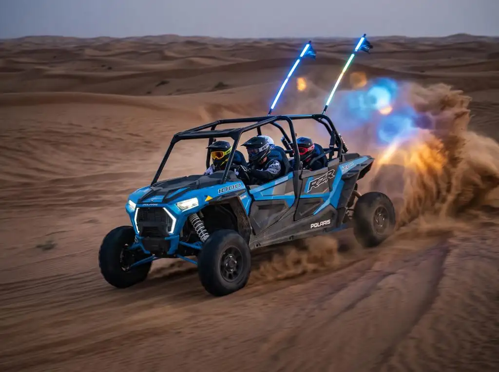 Blue Polaris RZR XP 1000 4-seat dune buggy with whip lights in the Dubai desert
